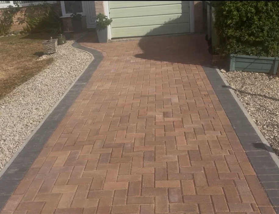Newly installed herringbone block paving driveway with charcoal border edging, Trowbridge, Wiltshire