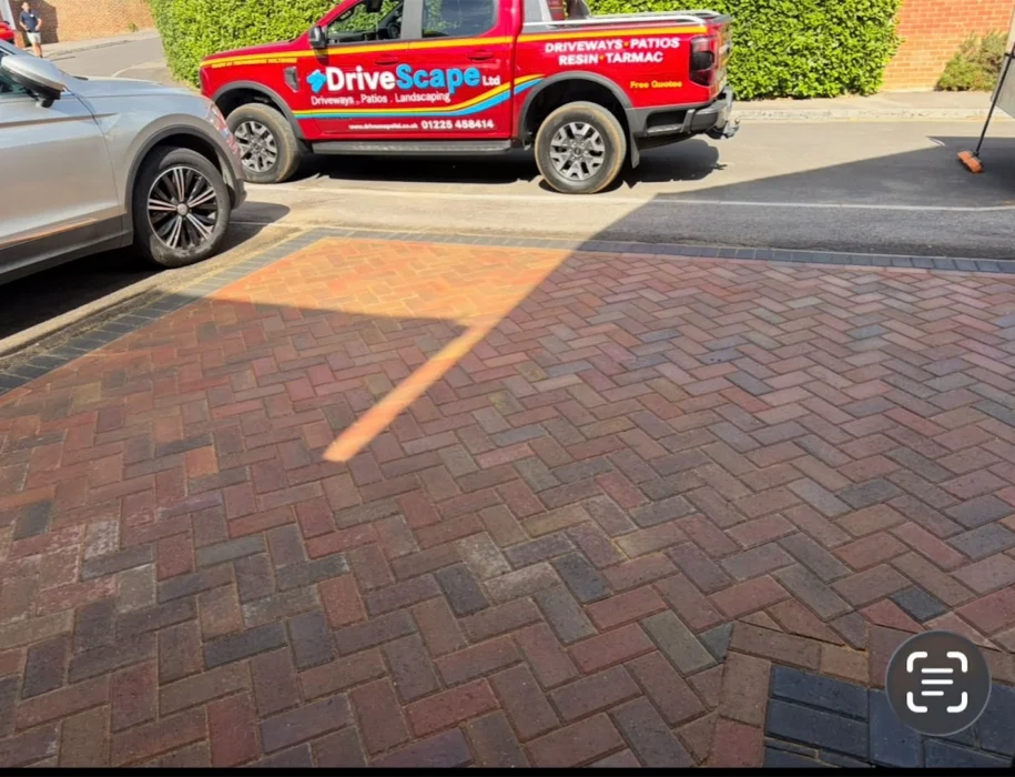 DriveScape Ltd van parked beside a freshly completed herringbone block paving driveway