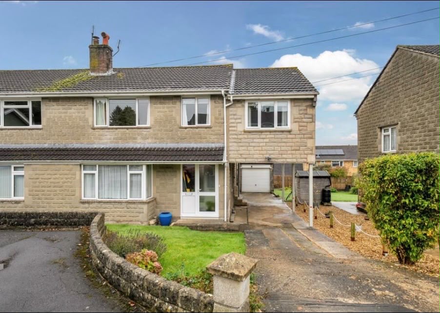 Semi-detached stone house with a plain concrete driveway before block paving installation, Trowbridge