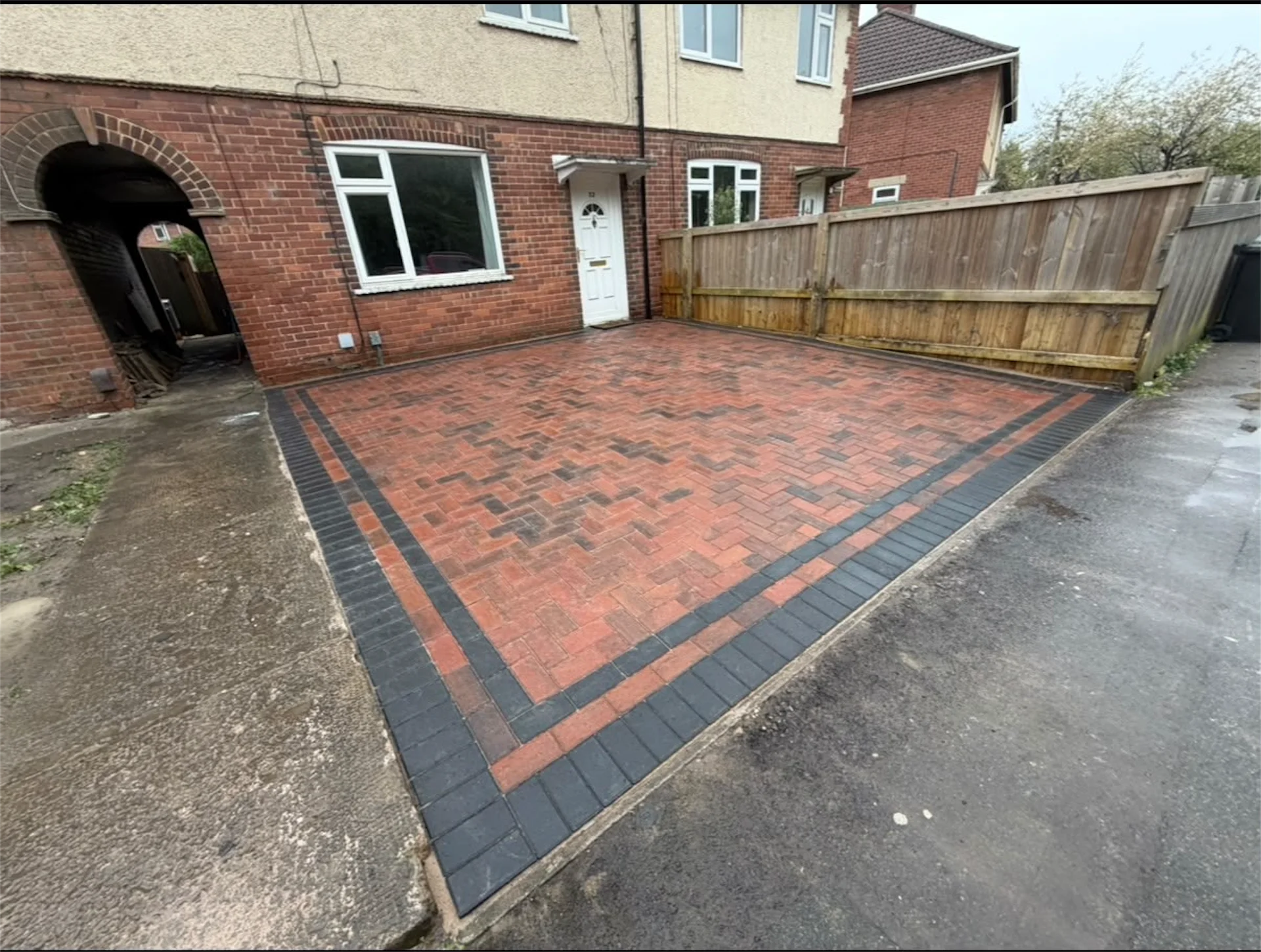 Completed block paved driveway laid in 90 degree herringbone pattern with charcoal edging border, Trowbridge